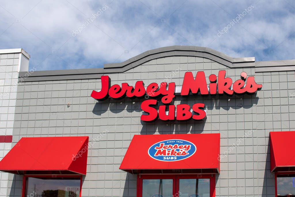 Oshkosh, WI - 25 July 2020:  A storefront sign of Jersey Mikes subs since 1956