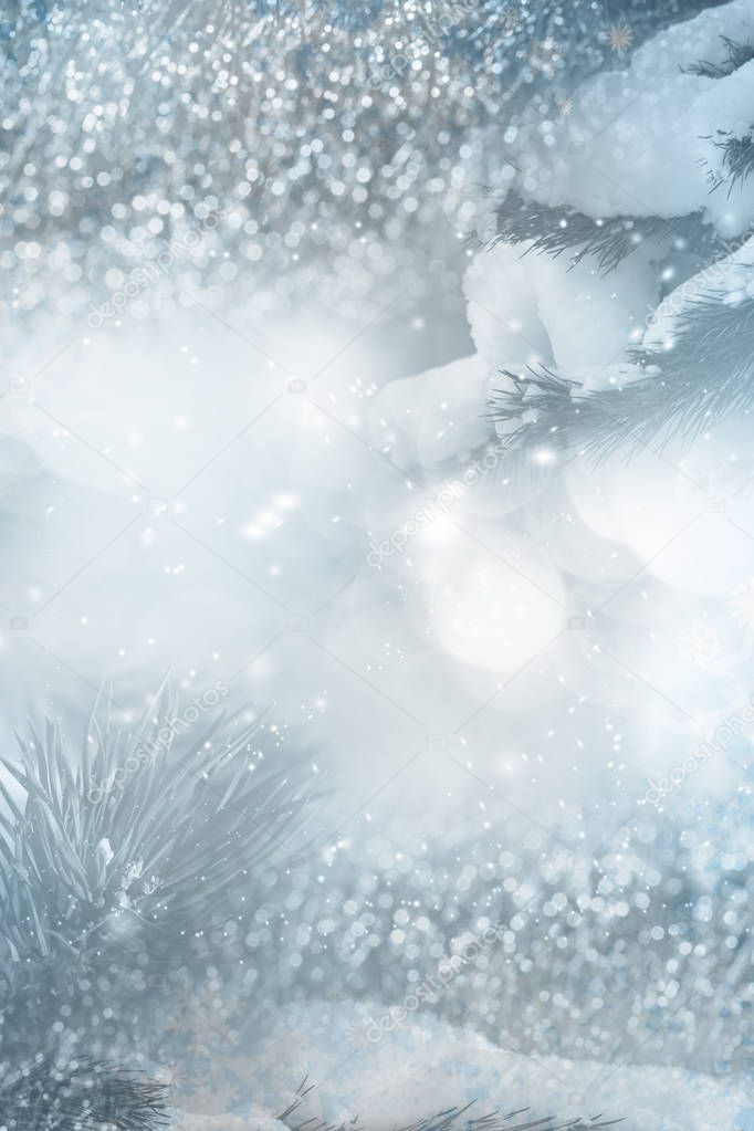 Abstract winter background with lights and tree branches