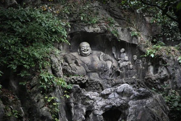 Hangzhou Happy, or Laughing, Buddha rock carving (Feilai) at Lingyin Temple (Soul\'s Retreat Temple) near West Lake HANGZHOU, CHINA