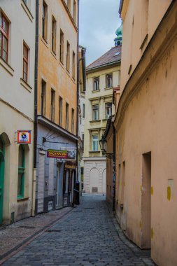narrow street view of old buildings, krakow
