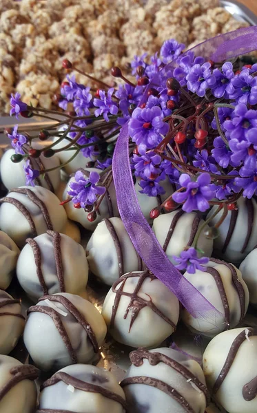 Glazed round candies with violet flowers
