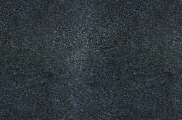 Dark wall, textured background.