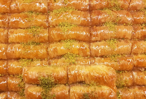 Baklava covered with pistachios nuts - traditional eastern desserts