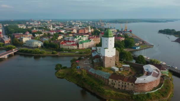Aerial: Vyborg castle on small island old castle, tower of St. Olav — 图库视频影像