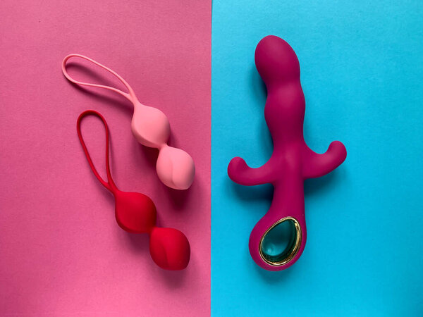 Sex toys. Vibrator and orgazm balls on a colored background. Useful for sex shop, adults