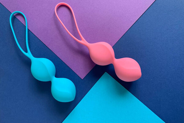 Sex toys. Two jiggle balls on a colored background. Useful for sex shop, adult