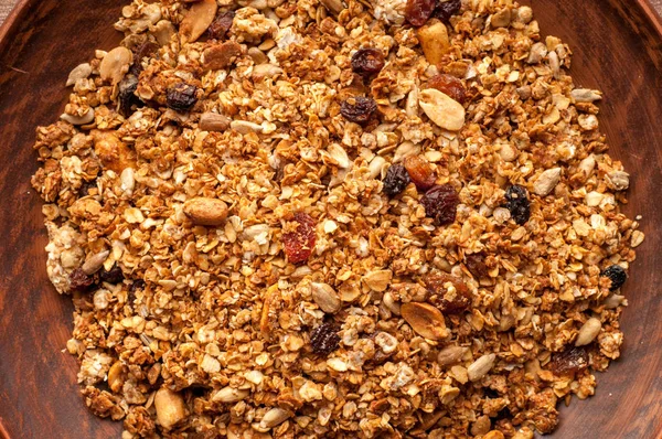 Bowl with granola on a wooden background — Stock Photo, Image