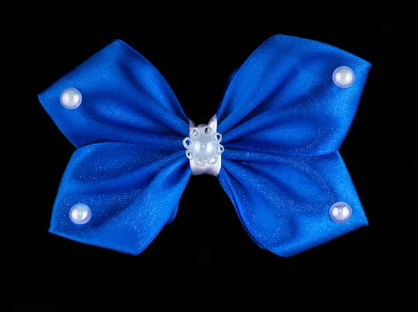 Children\'s hair bows on black background. Handmade