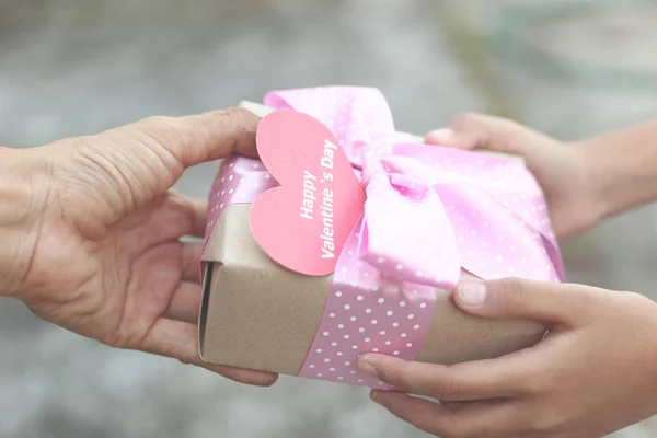 Happy valentines day - Love forever ,dirty hands give beautiful gift box to another