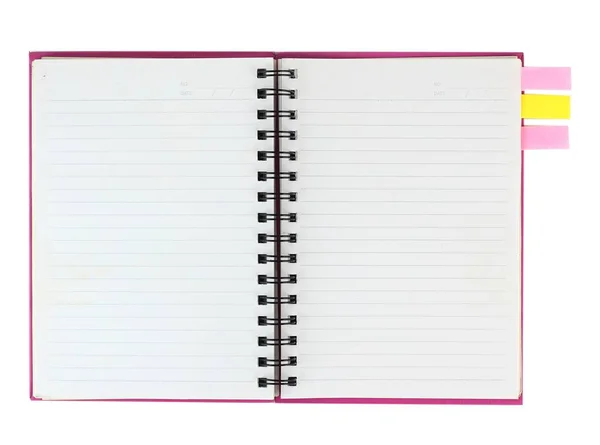 Cuaderno en espiral rosa y papel de nota aislado en blanco —  Fotos de Stock