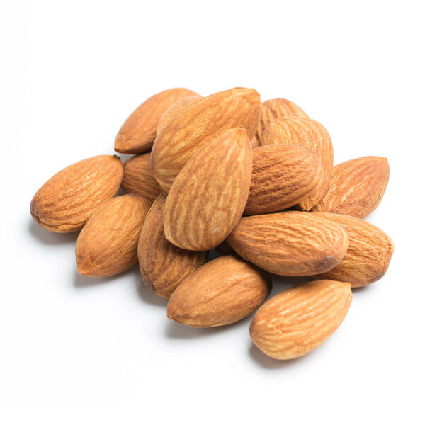 closeup of almonds isolated on the white background