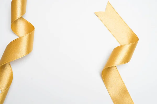Gold Ribbon Roll White Background — Stock Photo, Image