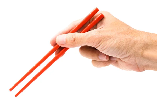 手拿着孤立的白色背景上的红色筷子 — 图库照片