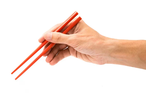 Mano Sosteniendo Palillos Rojos Aislados Sobre Fondo Blanco —  Fotos de Stock