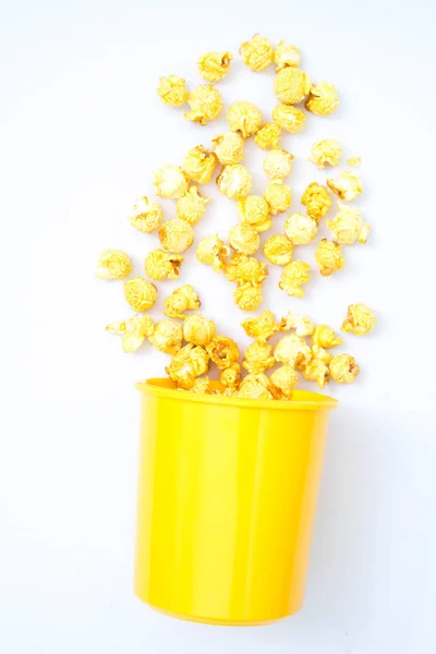 popcorn in bucket on white background