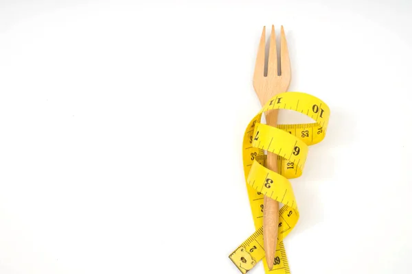 Voorvork met een meetlint dieet of gezond eten — Stockfoto
