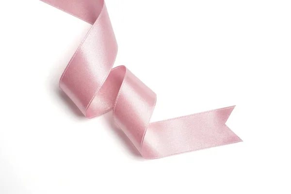 Розовая лента в рулон на белом — стоковое фото