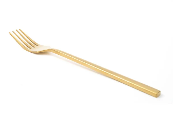 Tenedor dorado aislado sobre un blanco — Foto de Stock