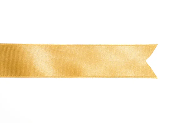 Gold ribbon in roll on white — Stock Photo, Image