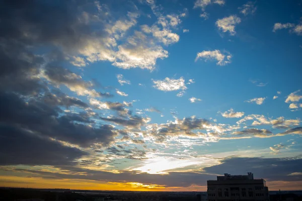 sky at sunrise over the city