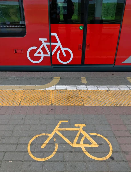 Bicycle sign on platform and on train or metro tram side and doors. Public transportation adapts to the ecological needs of the new urban mobility.