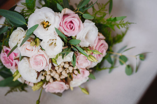 Wedding bouquet made of fresh flowers - pink and white roses bouquet