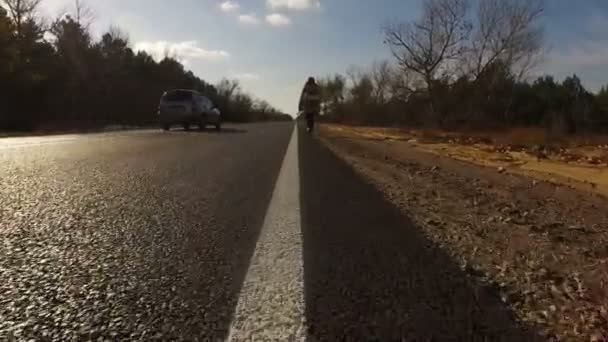 Young Girl Tourist Hitchhiker Walks Road Backpack His Shoulders Lifting — Stock Video