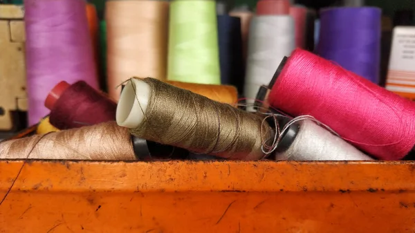 Colored thread close up, group of sewing thread,