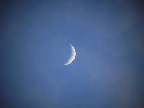 half moon at blue sky