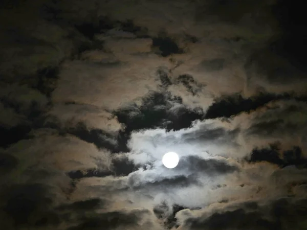 full moon at night clouds sky