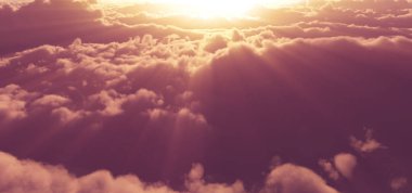 Bulutların üstünde güneş ışığı