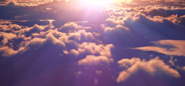 Bulutların üstünde güneş ışığı