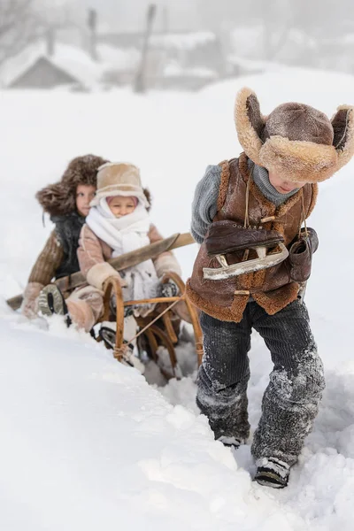 Older Boy Sled Driven Two Small Children Sledding Skiing Ice — Stock Photo, Image
