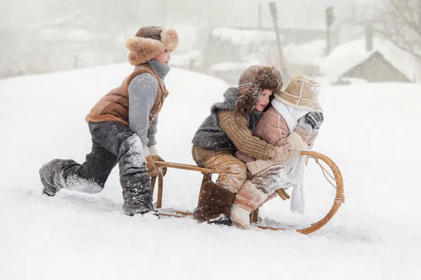 Three Small Children Slide Hills Sleds Winter Sunny Day — Stock Photo, Image