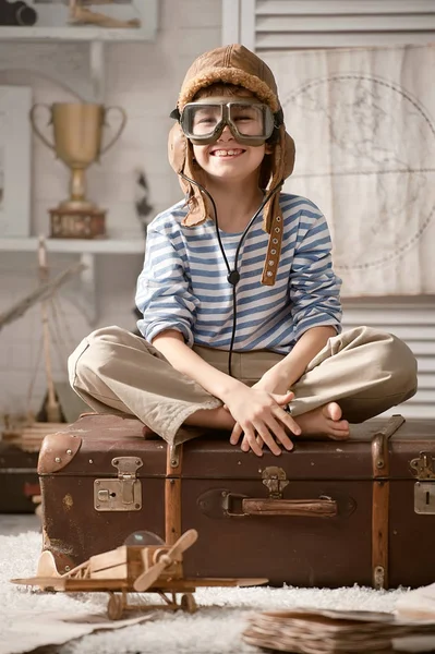 Boy in his room playing with plane — Stock Photo, Image