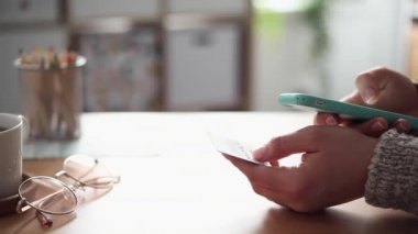 Young Woman Buys Online Using her Phone