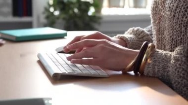 Young Blogger at Work Typing her New Post