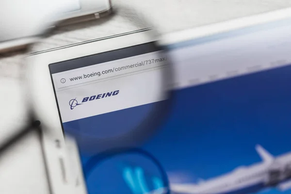 Bishoftu, Ethiopia - March 15, 2019: Boeing Company, 737 max, official website homepage under magnifying glass. Concept Boeing Company, 737 max, Aircraft logo visible on smartphone, tablet screen — Stock Photo, Image