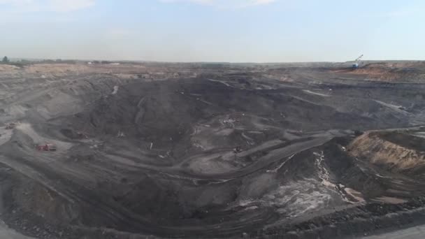 Panorama aerial view shot open pit mine coal mining, dumpers, quarrying extractive industry stripping work. Big Yellow Mining Trucks. View from drone at opencast mining with lots of machinery trucks — Stock Video