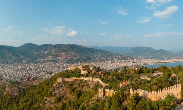 stock image Panorama of the old town overlooking the beach. View of the resort town. Alanya is popular tourist destination in Turkey. Panorama in high resolution observed from Fortress of Alanya