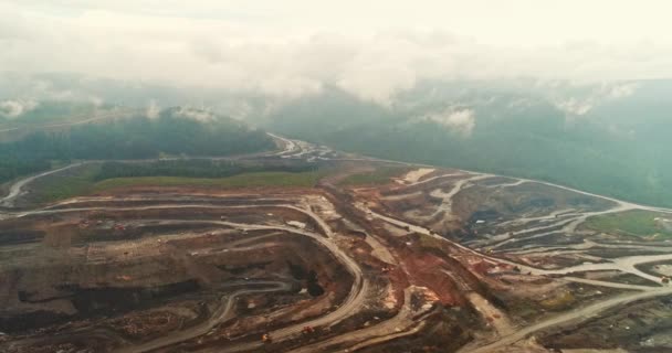 Panorama aerial view shot, open pit mine, coal mining, dumpers, quarrying extractive industry, stripping work. View from drone at opencast mining with lots of machinery trucks — Stock Video