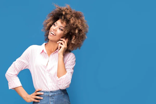 Beautiful Afro Woman Talking Mobile Phone Smiling Standing Blue Background — Stock Photo, Image
