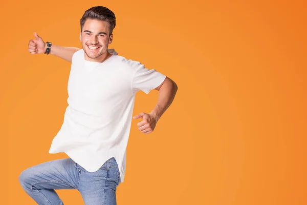 Photo Smiling Young Man Showing Okay Symbol Jumping Isolated Yellow — Stock Photo, Image