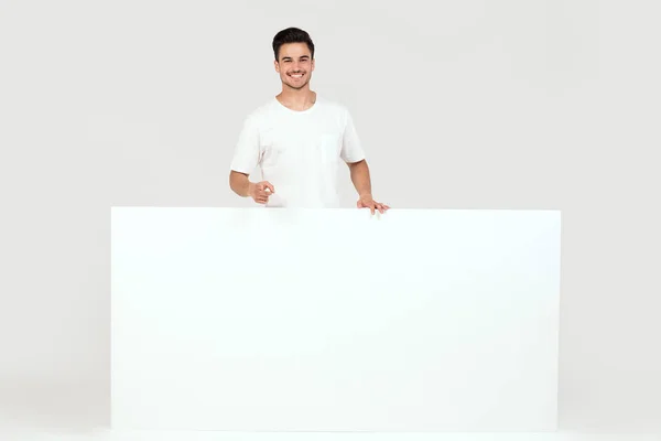 Handsome Guy Posing Blank White Banner Signboard Isolated White Studio — Stock Photo, Image