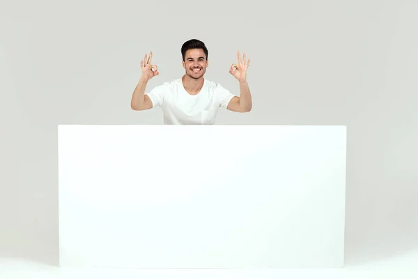Handsome Guy Posing Blank White Banner Signboard Isolated White Studio — Stock Photo, Image