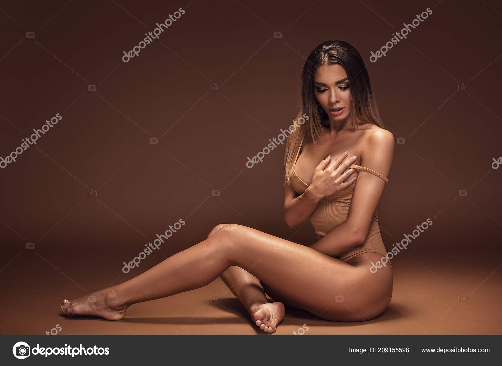 Attractive Beautiful Brunette Woman Ideal Tan Body Sensual Pose Girl Stock Photo by ©NeonShot 209155598