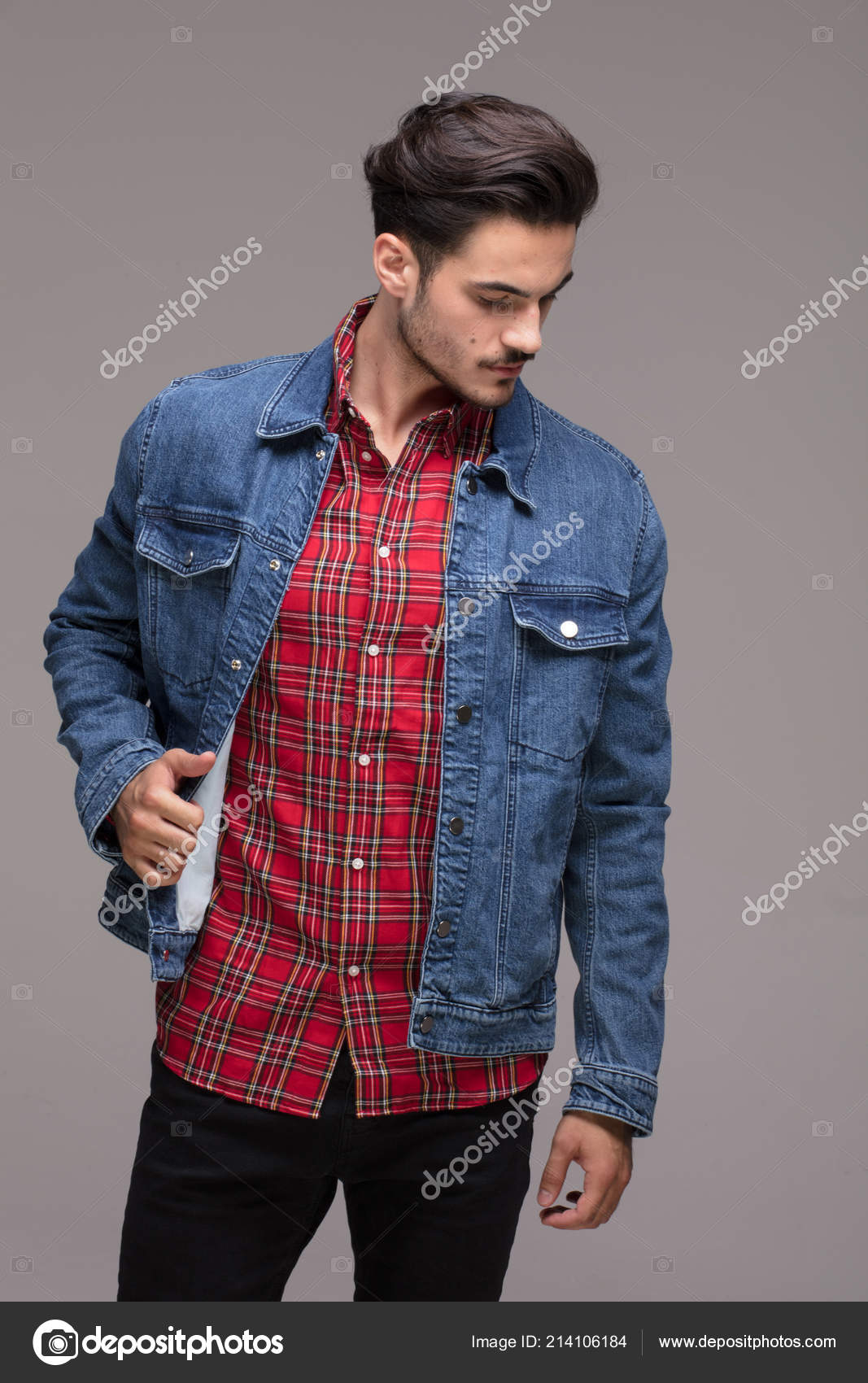 Young male model poses on the street dressed in jeans and blue denim jacket  with sunglasses on the eyes. Thinking of the future and great inspirational  ideas Stock Photo | Adobe Stock