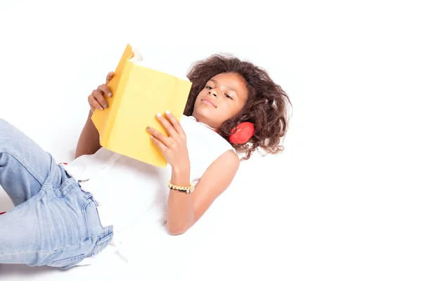 Young African American Girl Reading Book Relaxing Lying Floor — Stock Photo, Image