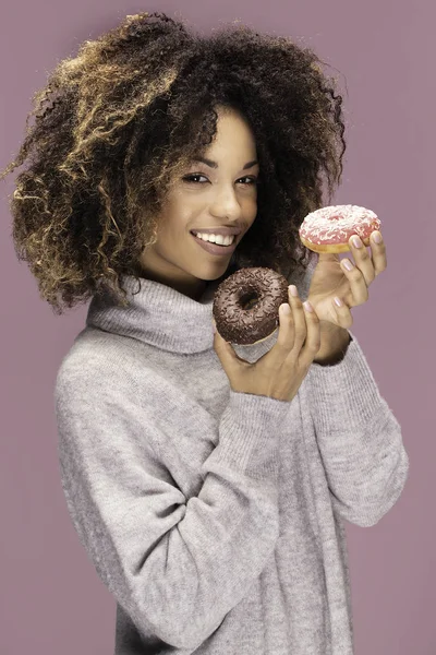 Young Afro American Woman Posing Pink Background Eating Donuts — Stock Photo, Image