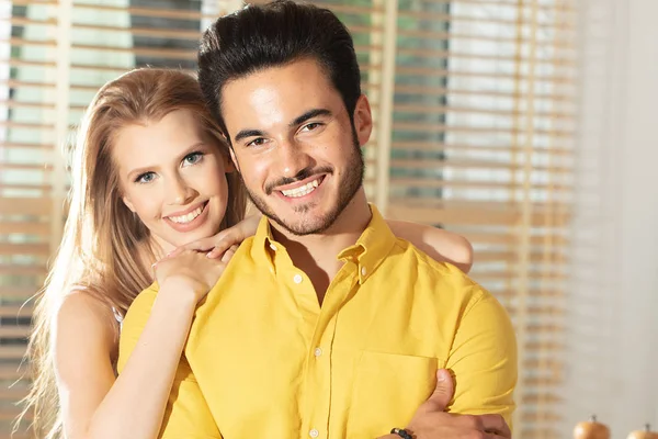 Young couple posing together, smiling. — Stock Photo, Image